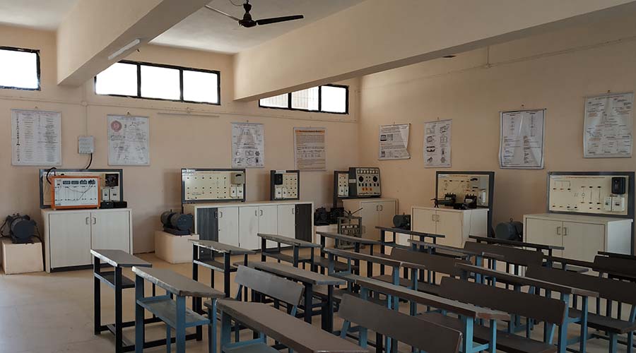 Electrical laboratory with benches and wall charts