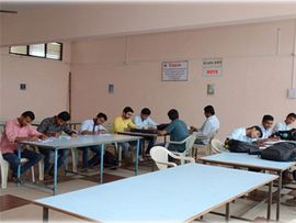 Students at reading tables in the library